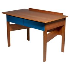 a wooden desk with a blue drawer underneath it