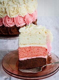 a piece of cake with pink and white frosting