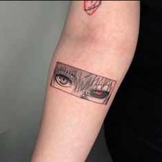 a woman's arm with an eye tattoo on it