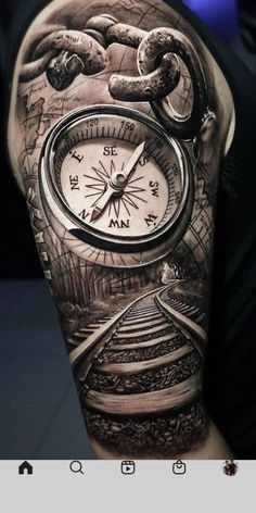 a man's arm with a clock and train tracks on it