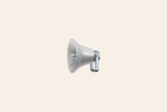 a white bullhorn on a beige background