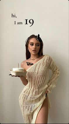 a woman in a white dress holding a cake on a plate with the words hi, i am 19