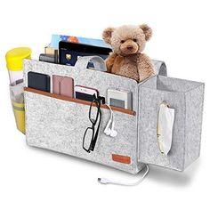 a teddy bear is sitting in an organizer