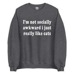 "This \"I'm not socially awkward. I just really like cats\" saying is screen-printed on Gildan 18000 unisex sweatshirt. A sturdy and warm sweatshirt bound to keep you warm in the colder months. A pre-shrunk, classic fit sweater that's made with air-jet spun yarn for a soft feel and reduced pilling. * 50% cotton, 50% polyester * Pre-shrunk * Classic fit * 1x1 athletic rib knit collar with spandex * Air-jet spun yarn with a soft feel and reduced pilling * Double-needle stitched collar, shoulders, Funny Slogan Sweatshirt In Relaxed Fit, Cotton Sweatshirt With Funny Text, Funny Text Relaxed Fit Sweatshirt, Coffee Plants, Gender Inclusive, Custom Sweatshirts, Bright Lights, Better Love, Cozy Sweatshirts