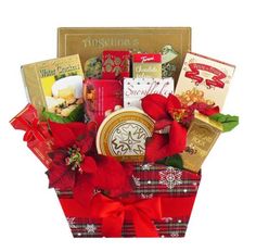 a christmas gift basket filled with chocolates, cookies and candy