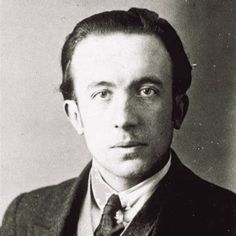 an old black and white photo of a man in a suit with a serious look on his face