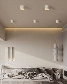 a bed sitting in the middle of a bedroom next to two lamps on either side of it