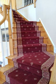 red carpeted stairs leading up to the second floor