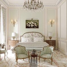 an elegant bedroom with chandelier, two chairs and a bed in the middle