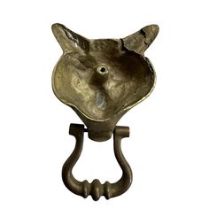 a metal hook with an animal's head on it