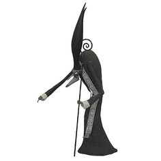 an animated character dressed in black and white holding a staff with one arm, wearing a long