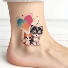 a small kitten and dog tattoo on the ankle