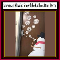 snowman blowing snowflake bubbles door decor on the side of a door with red border