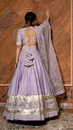 PRODUCT DESCRIPTION: LEHENGA: Cotton silk BLOUSE: Cotton silk DUPATTA: Organza COLOR: lilac work : Gotta lace and phool work. LINING: CANCAN with cotton lining No. Of Components : Set of 3 POTLI BAG : INCLUDED Wash Care : Dry Clean MADE TO ORDER SKU#: 11423164PR Disclaimer: All our pieces are handcrafted in our manufacturing unit .We Ensure that our pieces are shot professionally under controlled lighting. Colours tend to be perceived differently depending on factors such as shot angles, lightin Lengha Blouse Designs, Pola Blus, Simple Lehenga, Backless Blouse Designs, New Saree Blouse Designs, Lehenga Designs Simple, Latest Model Blouse Designs, Lehenga Blouse Designs, Fashionable Saree Blouse Designs