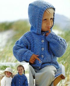 a young child wearing a blue jacket and hat