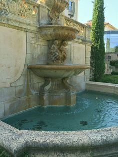 a water fountain in front of a building