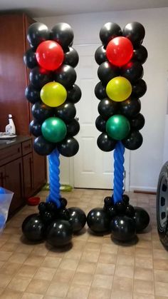 some balloons that are in the shape of traffic lights