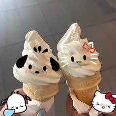 two ice cream cones with hello kitty faces on them