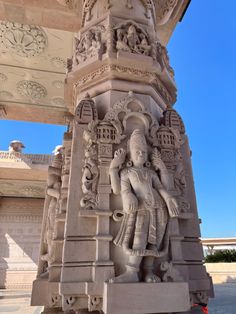 an intricately carved statue on the side of a building