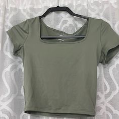 Never Worn! Army Green Color Spring Cropped Workout Tops, Cropped Workout Tops For Spring, Casual Cropped Workout Tops, Summer Workout Tops With Scoop Neck, Spring Workout Tops With Short Sleeves, Spring Workout Short Sleeve Tops, Green Workout T-shirt For Spring, Scoop Neck Spring Workout Top, Green Casual Workout Top