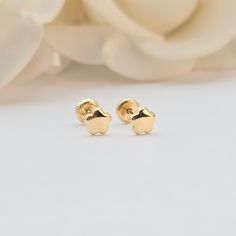 Delight in the charm of our Baby Flower Polished Stud Earrings. Crafted from 14k gold, these adorable earrings feature a delicate flower design and secure Spanish backings, perfect for little ears. Features: Material: High-quality 14k gold for a beautiful, lasting shine. Design: Cute flower shape with a polished finish. Post Size: .08mm, strong and comfortable ideal for baby ears. Why You'll Love Them: Adorable Design: Sweet flower shape that complements any outfit. Durable: Made to withstand everyday wear. Treat your little one to these precious Baby Flower Polished Stud Earrings. Order now and add a touch of elegance to their everyday look. Briza Collections is a small family owned business that works hard on providing the best selection of Fine Solid Gold Jewelry for the best prices. Ou 14k Gold Earrings With Flower Charm For Gift, 14k Yellow Gold Round Flower Earrings, Yellow Gold 14k Round Flower Earrings, Dainty Yellow Gold Earrings With Flower Charm, 14k White Gold Flower-shaped Earrings, 14k Gold Flower Charm Earrings, Dainty 14k Yellow Gold Flower Earrings, Hypoallergenic Yellow Gold Flower Earrings Gift, Hypoallergenic Yellow Gold Flower-shaped Earrings