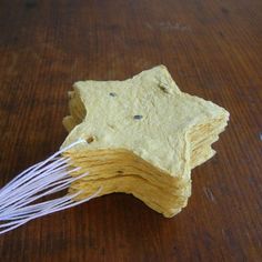 several pieces of food that have been cut into small stars and are sitting on a wooden table