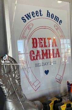 there is a sign in the window that says delta gamia