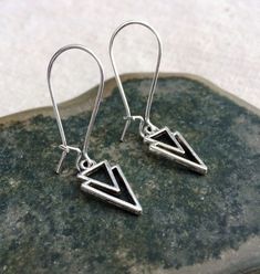 "Mod minimalist geometric earrings. Dainty yet striking! Perfect for everyday, year round wear. They measure 5/8\" long by 3/8\" wide and hang from 1\" silver kidney style ear wires that lick and match. Made from allergy free plated silver. Thanks so much for stopping by! Please take a moment and visit the rest of my Etsy shop. I have many more unique jewelry designs to choose from. Lots of great gift ideas too! 🌸 Tiger Flower Jewelry 🌸 🌸 Inspired by Nature 🌸" Dainty Sterling Silver Nickel-free Linear Earrings, Geometric Sterling Silver Earrings With Ear Wire, Adjustable Geometric Minimalist Earrings, Adjustable Minimalist Geometric Earrings, Everyday Geometric Sterling Silver Earrings, Modernist Nickel-free Earrings For Gift, Minimalist Nickel-free Triangle Earrings, Tiger Flower, Dainty Dangle Earrings