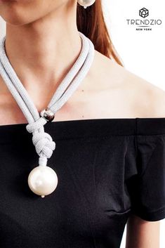 This could probably be one of the most uncommon necklaces you’ve seen. It is available in three different colors –black, white, and gold. This beautiful handmade rope necklace comes with a large faux pearl on the end. Womens Fashions, Black White And Gold, Big Pearl