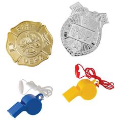 three different colored police badges and whistles on a white background with clipping cord