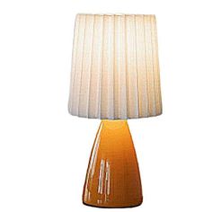 an orange table lamp on a white background