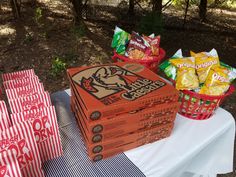 several boxes of snacks sitting on top of a table