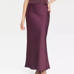 *New With Tags!* A New Day Maxi-Length Slip Skirt Is Made From Lightweight Satin Fabric For All-Day Comfort, While The Full Elastic Waistband Lends A Secure Fit. Tailored In A High-Rise Silhouette With A Slim Fit For A Flattering Look, You Can Pair This Skirt With Your Fave Tops And Footwear For Versatile Ensembles. Model Wears Size Xs And Is 5'9" Maxi Slip Skirt Lightweight Satin Fabric Full Elastic Waistband Slim Fit High-Rise Waist 100% Recycled Polyester Hand Wash Cold Season: Fall 2024 Elegant Purple Maxi Skirt, Casual Purple Relaxed Maxi Skirt, Fitted Purple Lined Maxi Skirt, Burgundy Slip Skirt, Purple Satin Skirt, Purple Relaxed Full Maxi Skirt, Maxi Slip Skirt, Slip Skirt, Cold Season