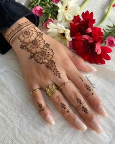 henna tattoo on the hand and flowers