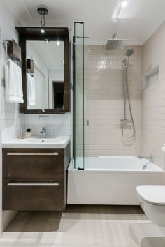 a bathroom with a sink, toilet and bathtub