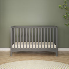 Cool gray crib against a soft green wall Gray Crib Nursery, Grey Crib Nursery, Outdoorsy Nursery, Gray Crib, Bed Day, Dresser And Nightstand, 4 In 1 Crib, Grey Crib