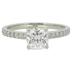 a white gold engagement ring with diamonds on it