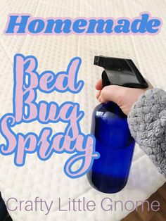 someone is holding a blue bottle with the words homemade bed bug spray on it and there is a cell phone in one hand