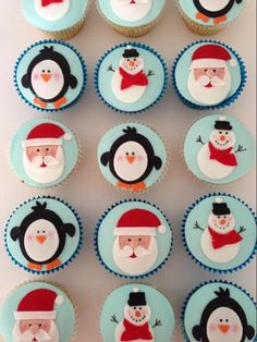 cupcakes with frosting decorated as santa claus and penguins