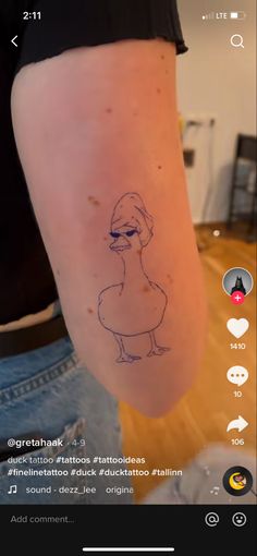 a person with a small tattoo on their arm