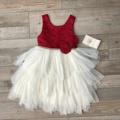 Beautiful Dress With A Red, Lace Top And Tiered Cream, Straight Tulle On The Skirt. There Is A Jeweled Band On The Waist Of The Front And Cream Straps That Tie In The Back. There Is A Hidden Zipper On The Back Of The Dress. The Dress Is 100% Polyester And Is Machine Washable. Cute Red Sleeveless Princess Dress, Cute Red Tutu Dress With Ruffles, Cute Red Sleeveless Tutu Dress, Cream Formal Dresses, Pink Toddler Dress, Zara Girls Dresses, Red Lace Top, Satin Flower Girl Dress, Girls Lace Dress