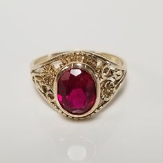 Thanks for shopping our vintage estate store. We tend to sell well below wholesale and truly hope you enjoy all of our items. Many of the items are one of a kind, so please enjoy scrolling through the pictures and hopefully something will catch your eye. Estate 10k yellow gold created .50ct ruby vintage filigree ring. Beautiful ring and will make a nice present. Ruby is oval created. Ring size: 4.5 Setting: 3/8" 8mm Band width: 1.5mm Weight: 2.01 grams Beautiful ring. Marked 10k. Cheap Antique Oval Jewelry, Estate Style 14k Gold Oval Jewelry, Classic Ruby Signet Ring, Estate Style Oval Yellow Gold Rings, Estate Oval Ring Stamped 14k, Yellow Gold Oval Estate Rings, Oval Yellow Gold Estate Rings, Estate Oval Jewelry For Gifts, Estate Oval Jewelry For Anniversary