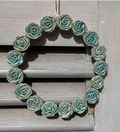 a close up of a wreath made out of paper flowers