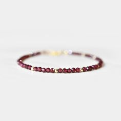 "This hand made bracelet (1) showcases a stunning selection of genuine Garnet gemstones. This makes a wonderful gift for someone with a January birthday, or any Garnet-lover in your family or friend circle. All jewelry will arrive in an elegant, ready-to-gift drawstring pouch within a gift box. Bracelet Size Guide: This adjustable bracelet measures 6.5\" with a 1.5\" extender chain, for a total wearable length of 8\". This bracelet fits 99% of recipients. If for any reason you need an adjustment Faceted Rondelle Bracelets As Gift, Faceted Rondelle Bracelet As Gift, Rondelle Faceted Bracelet As Gift, Gift Rondelle Gemstone Beads Bracelets, Gift Gemstone Beads Bracelets In Rondelle Shape, Faceted Bangle Bracelets For Gift, Faceted Bangle Bracelet As Gift, Black Obsidian Bracelet, January Birthstone Jewelry