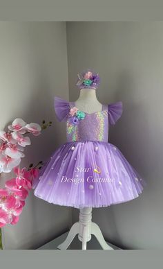 Hello☺️Our dresses are handmade products.Personalized design is available🌸you can let me know by sending a message.Our dresses use cotton lining and have a hidden zipper at the back.Dense layers of tulle are used on the skirts of our dresses and they are fluffy dresses,A hair accessory is also sent as a gift along with the dress🎁We deliver your order within 4 business days with fast shipping💖Thank you for choosing us and we wish you pleasant shopping.⭐️⭐️⭐️⭐️⭐️ Fitted Fairy Style Princess Dress For Wedding, Fairytale Purple Dress For Party, Purple Fairy Dress For Dress-up Occasions, Purple Fairy Style Dress For Dress-up, Purple Fairy Costume Dress, Princess Style Fitted Fairy Dress For Pageant, Whimsical Purple Princess Dress For Wedding, Fitted Sleeveless Mermaid Dress For Dress-up, Purple Mermaid Tutu Dress For Dress-up