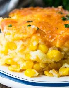 a close up of a plate of food with corn