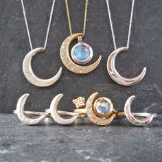 "This unique crescent moon phase pendant is available in silver or 14 k gold. So beautiful polished but equally stunning hand-finished matte, hammered or have it encrusted with diamonds. A focal piece that can be stacked with smaller pendants. It's a slide providing space for a pendant to fit into the opening. We've paired it with our bezel set moonstone. crescent moon 24 millimeters long x 19 mm wide or/ almost 1\" long x 3/4\" wide 14k solid gold or sterling silver pave Diamond encrusted Cresc Hand Forged Moonstone Jewelry In Yellow Gold, Elegant Diamond Moon Phase Jewelry, Fine Jewelry With Moon Charm For Wedding, Luxury Silver Jewelry With Moon Charm, Hand Forged Sterling Silver Celestial Necklace, Hand Forged Moon-shaped Gold Jewelry, Elegant Crescent Moonstone Necklace, Hand Forged Moon Shaped Gold Jewelry, Anniversary Jewelry With Half Moon Charm