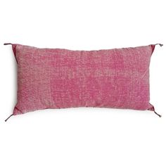 a pink pillow on a white background