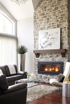 a living room filled with furniture and a fire place