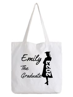 a white tote bag with an image of a graduate